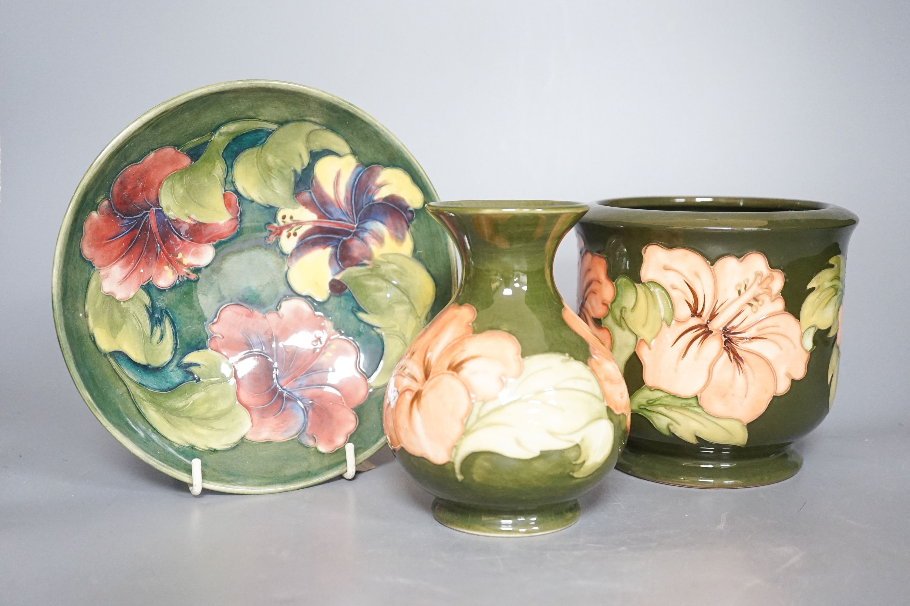 A Moorcroft hibiscus pattern vase, bowl and plant pot 19cm